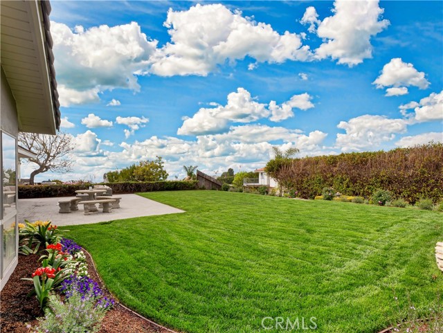 View of grassy area and plants from outside Master Suite.