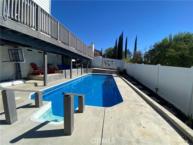 In ground pool with swim wave
