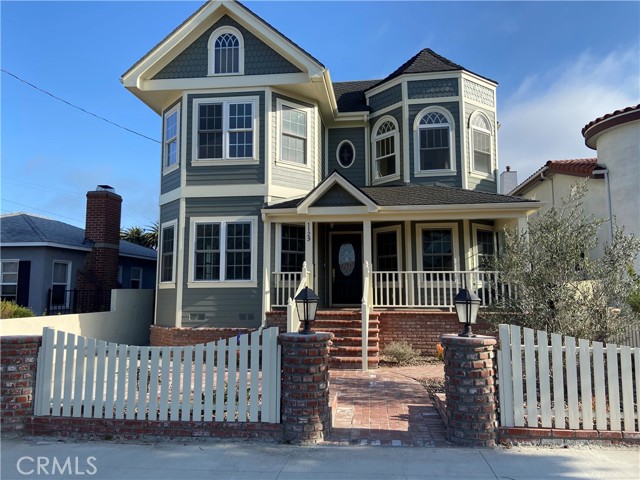1129 W 20th Street San Pedro, California Welcome home to 1129 W 20th Street. Custom build in 2003.This kind of home rarely comes for lease. A luxurious 4 bedroom 5 bath Victorian gem is located in heart of San Pedro. This chic residence is nearly 3000 sq. ft. and was expertly designed to marry the serenity of a life by the sea with the pride and luxury of resort-style living. In this prime Vista Del Oro location, you area surrounded by the best of California coastal living. The inviting porch opens to newly refinished hardwood floor with the long entry hallway and staircase. Main level enjoys a guest bedroom ensuite, living room with fireplace, powder room, formal dining room, spacious family room and kitchen area with pantry and breakfast nook. The gourmet kitchen is equipped with all new appliances,36" stove/oven and new side by side frig and dishwasher. Custom cabinets and center Island are adorned in granite. Upstairs you will find landing area with plenty cabinets space with laundry room, master suite with sitting area and huge master bath with soaking tub, separate shower with walk in closet. Two addition bedrooms also ensuite on opposite side. Home enjoys huge 800 sq. ft. basement / game room and separate office. The rear yard has a large patio perfect for family get together. The two car garage has a bath / shower and 600 sq. ft. room above, perfect for guest, office or play room. Addition feature include motorized rear gate for ease in / out access. Two AC and heating units, new land scaping, alarm system, camera system, speakers thru-out , wall mounted prewired locations for tv's, Cat 5 wiring, huge storage area. Four cars parking space, one parking space at front and one of the rear gate plus a two car garage.