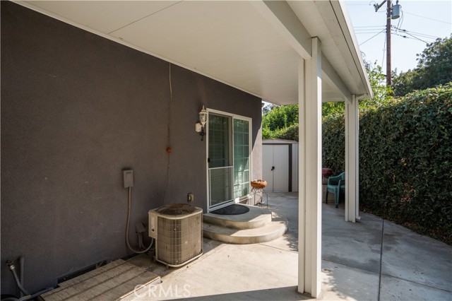 ADDITIONAL YARD SPACE WITH 2ND COVERED PATIO WITH DOUBLE DOORS LEADING TO 2ND MASTER SUITE