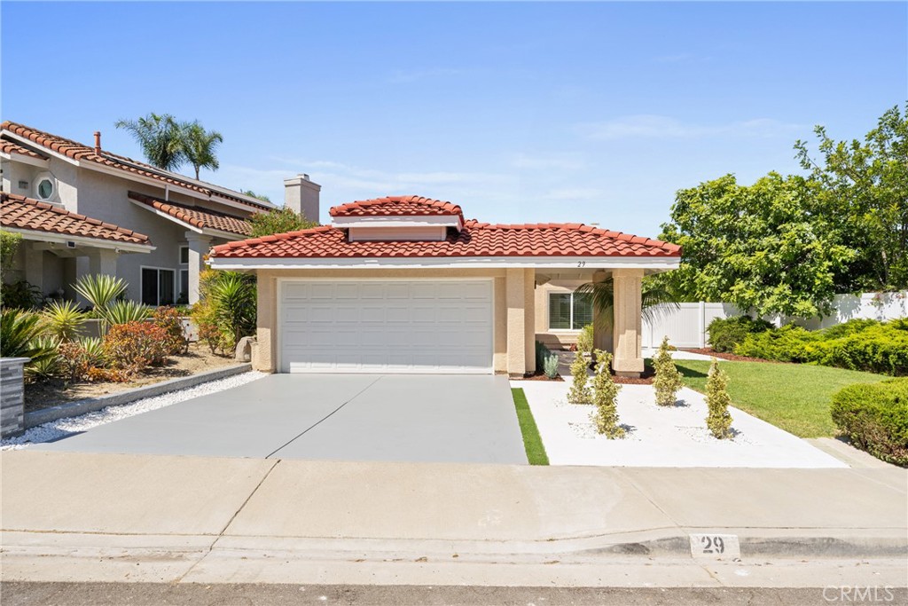 Welcome to 29 Saint Croix, a beautifully remodeled single-story residence in the highly sought-after Mariners Bluff neighborhood of Laguna Niguel. This two-bedroom, two-bathroom home offers the perfect blend of quality, comfort, and tranquility in an unbeatable location. Upon entering, you are greeted by an open floor plan filled with natural light, vaulted ceilings, and a seamless flow from the spacious living room with a cozy gas/wood-burning fireplace into the dining area and kitchen. The newly upgraded kitchen is a chef’s delight. The primary bedroom is a luxurious retreat, boasting an ensuite bath with a dual sink vanity, an expansive walk-in shower with pebbled stone flooring, and dual shower heads. The secondary bedroom and adjacent bath are equally impressive, providing ample space and privacy. This home is just a short distance from Dana Point Harbor, local beaches, shopping, dining, and convenient access to freeways and toll roads. Don't miss the opportunity to own this stunning, move-in-ready home in Mariners Bluff!