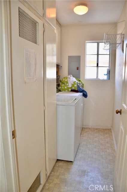 Spacious downstairs laundry room next to guest bath