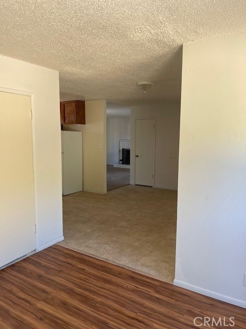 View from family room to living room; kitchen to the left.