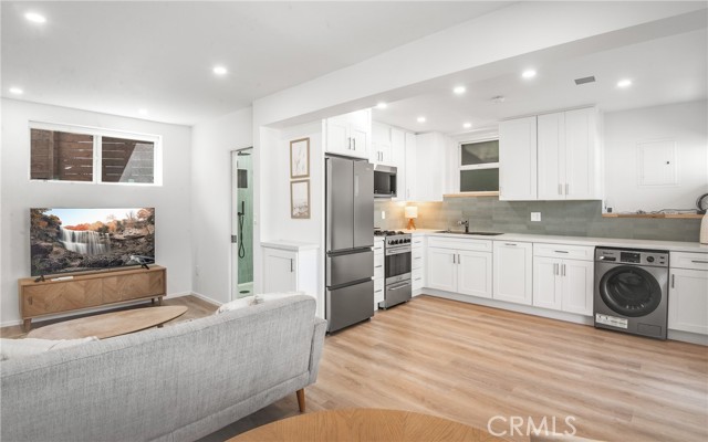 Open living, dininig and kitchen in the downstairs 1 bed 1 bath unit