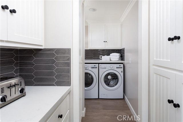 Laundry room off kitchen; lots of storage.