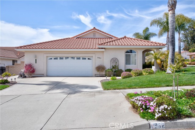 Drive into the garage and put away your surfboard in the custom built cabinets in this oversized two car garage.