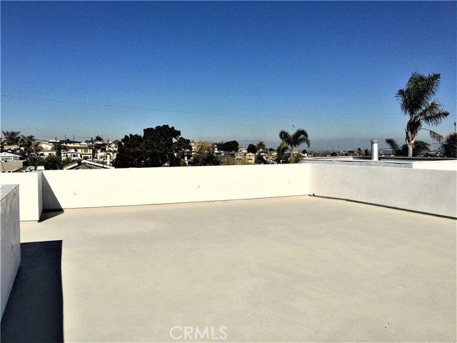 Large rooftop deck with Ocean and City lights views