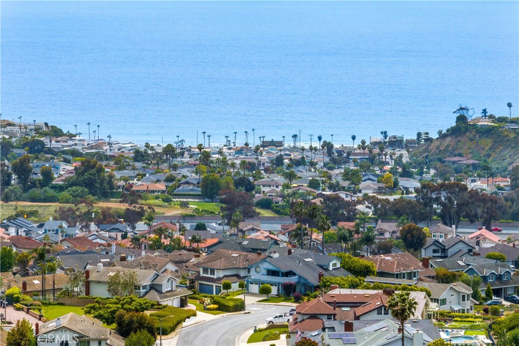 This beautifully renovated 4-bedroom residence in the desirable Coast community of San Clemente is ready to impress. Step inside to discover a spacious open floor plan that begins with a formal living room featuring soaring vaulted ceilings and a stunning natural stone fireplace with a sleek quartz hearth. Adjacent to the living room is an elegant dining area, generously sized to accommodate gatherings of family and friends. At the heart of the home lies a fully reimagined kitchen designed for modern living. It boasts a large center island with quartz countertops, recessed lighting, shaker-style cabinetry. The kitchen seamlessly connects to the cozy family room and a charming breakfast nook, creating a perfect space for entertaining or daily life. The first floor also offers a convenient bedroom and ¾ bathroom, a dedicated laundry room, direct access to a spacious 3-car garage, and an expansive backyard ready for outdoor enjoyment. Throughout the home, the blend of light walls and rich wood tones creates a coastal-inspired ambiance, capturing the essence of San Clemente living. Upstairs, the primary suite is a true retreat, showcasing vaulted ceilings, its own fireplace, a walk-in closet, and a luxurious spa-inspired bathroom. Additional bedrooms and bathrooms continue the home’s theme of thoughtful design and modern upgrades. With no Mello-Roos, a low HOA, and just minutes from downtown San Clemente, this property combines style, comfort, and an unbeatable location. Don’t miss the opportunity to make this exceptional home your own!