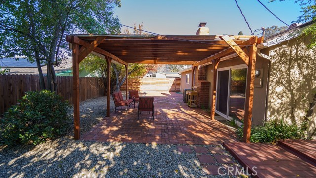 Shady pergola over brick patio