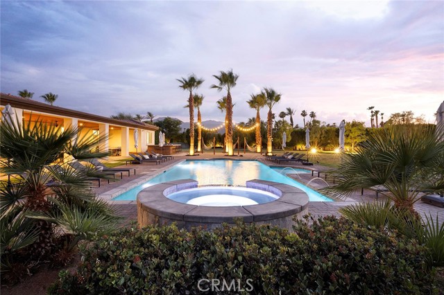 Exceptional multi-generation compound with significant income opportunity. With high-end rental properties becoming more and more desirable in today’s market, Indio’s prized Strut Oasis presents a once-in-a-lifetime opportunity to capitalize on current trends and reap tremendous rewards. Discover five contiguous properties spanning over six acres near Coachella’s festival grounds at the Empire Polo Club, which hosts the world-famous Coachella and Stagecoach music festivals. Two luxurious rental homes are currently on pace to produce over $900,000 in annual rental income; a third home offers renovation opportunities; and two additional rental homes can be built on large lots to increase total annual rental income to more than $2 million, per current projections. The homes provide above-market rental income during festivals and at-market rental income throughout the rest of the year. With their enviable proximity to events attended by more than 100,000 people, the Strut Oasis offers a unique opportunity to enjoy and grow a very profitable rental income stream. Properties at the compound include 81870 Sandy Ct. with a 57,499 SF lot and a remodeled 7-bedroom, 5-bath home of 4,497 SF; 81871 Sandy Court with a 57,499 SF lot and a remodeled 7-bedroom, 3-bath home of 3,453 SF; 48755 Southview Pl. with a 57,000 SF lot and a 5-bedroom, 3-bath home of 2,786 SF; 48753 Southview Pl. spanning 43,560 SF; and lot 1 APN: 616-370-080,081-083, which measures 43,560 SF. All measurements are approximate. Resort-caliber amenities vary per property and include large swimming pools, spas, sand volleyball, romantic open-air fireplaces, a putting green, hammocks, on-trend interior design, exquisite finishes and fixtures, state-of-the-art audio and video, billiards, top-tier linens, sprawling lawns, generous garage and driveway parking, and open-concept floor plans. Two side-by-side villas can be rented together to combine the cul-de-sac properties into one large estate featuring a total of 14 bedrooms, 8 bathrooms, nearly 8,000 square feet of interior space, and approximately 2.6 acres of resort grounds. Tickets for 2023's Coachella Valley Music and Arts Festival are already selling, making this the ideal time to make the fabulous Strut Oasis your very own.