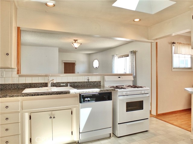 Double Sink - Granite Countertop w/Crisp White Tile backsplash