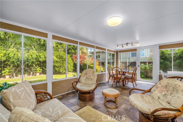 1st level enclosed porch/patio with easy access to back yard