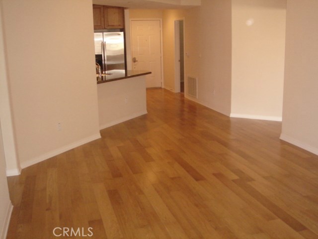 Original hardwood flooring underneath current carpeting.