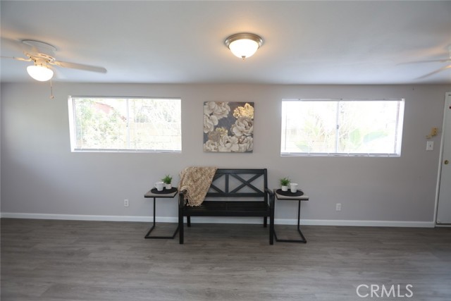 Family room, new laminated flooring, fresh paint, with access to the side yard and back yard