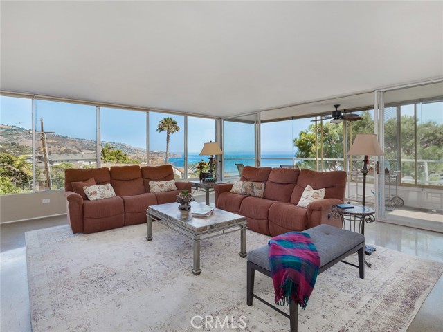 Living room has huge windows on both sides to allow for exceptional views!