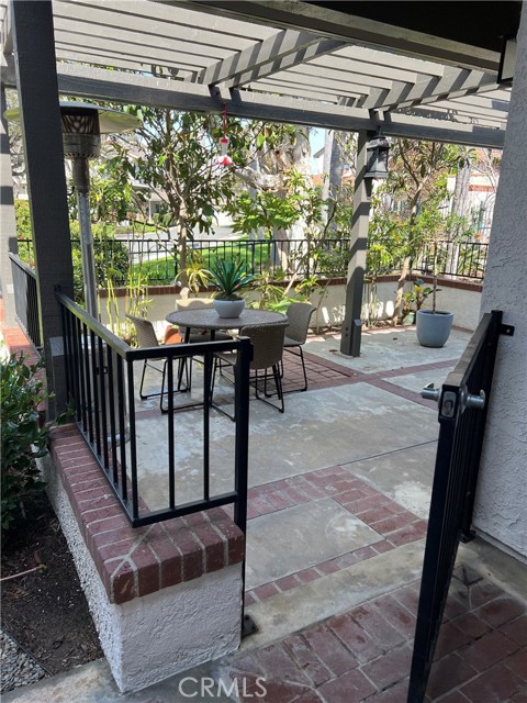 Gated patio steps to common Spa