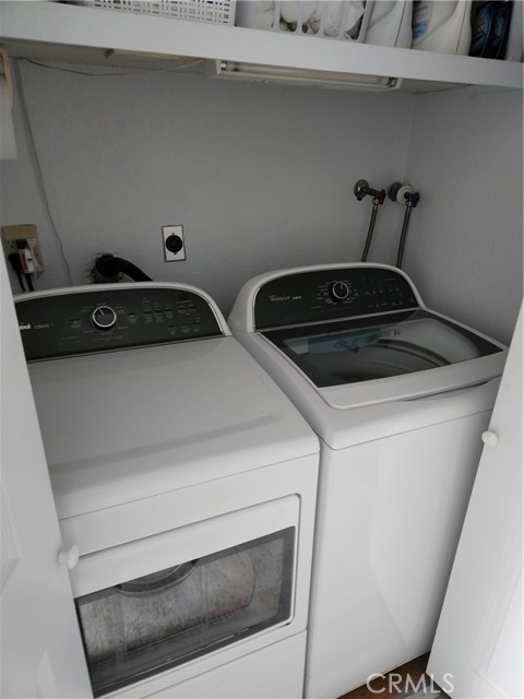 Laundry room in hallway closet