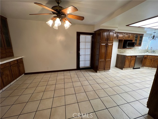 Kitchen & Dinette area off the living room and dining room. Door leads to side yard and outside stairs to second level.