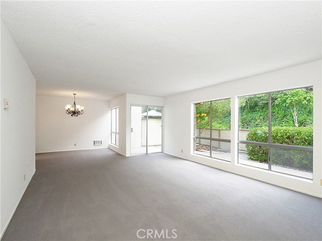 Large living area with sliding doors out to enclosed back patio