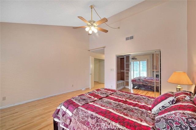 Master Bedroom.  Mirrored Sliding Glass Doors To Huge Walk-in Closet.  Overhead Ceiling Fan For Cooling Breeze.  Cathedral Ceiling For Open Feeling!