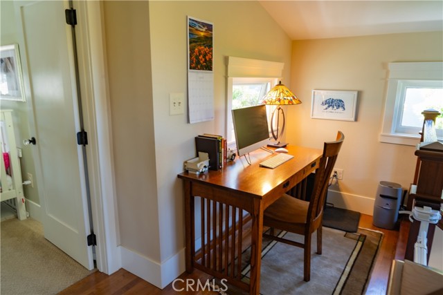 Office landing overlooking the tree lined street.