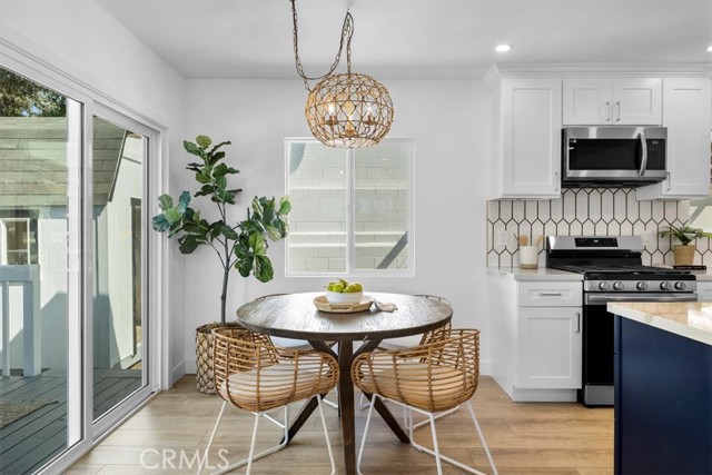Dining area with so much light and perfectly leads to the deck outside for more seating, eating, drinking, and entertaining.