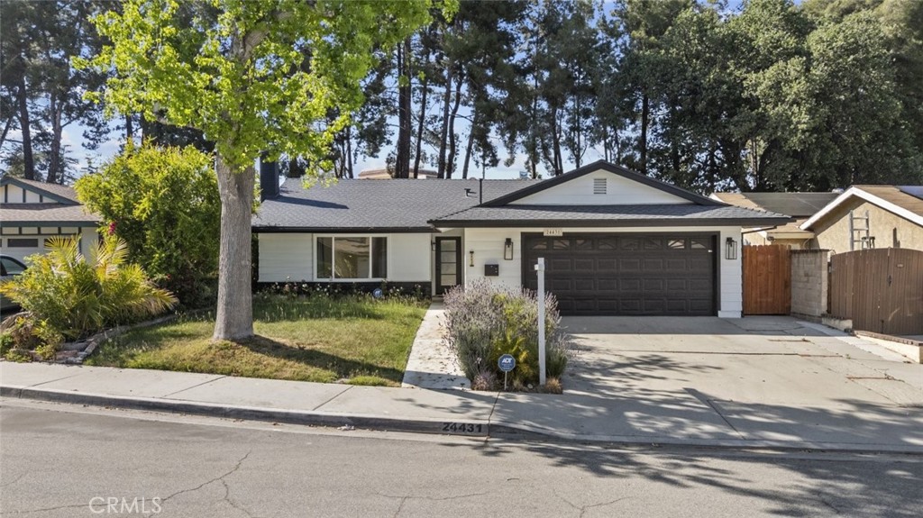 Beautifully remodeled 4 bedroom, 2 bathroom home located in the heart of Santa Clarita, offering 1914 square feet of stylish and functional living space. This stunning residence features an open floor plan with a sleek black and white modern design that brings sophistication and warmth throughout.

The kitchen is a true centerpiece, newly upgraded with contemporary finishes, ample cabinetry, and space for cooking and entertaining. Recessed and natural lighting fill the home, highlighting the spacious layout and creating a bright, inviting atmosphere.

Each bedroom is generously sized, while the bathrooms offer clean, modern updates. Step outside to a nicely sized backyard, perfect for relaxing, entertaining, or enjoying the Santa Clarita sunshine. This move-in ready home combines comfort, style, and convenience in one of the area's most desirable neighborhoods.