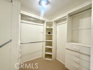 Plenty of storage in the primary bedroom walk-in closet.