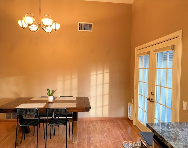 French doors open to the side patio