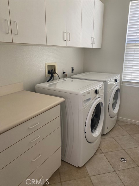 Upstairs laundry room with great folding counter