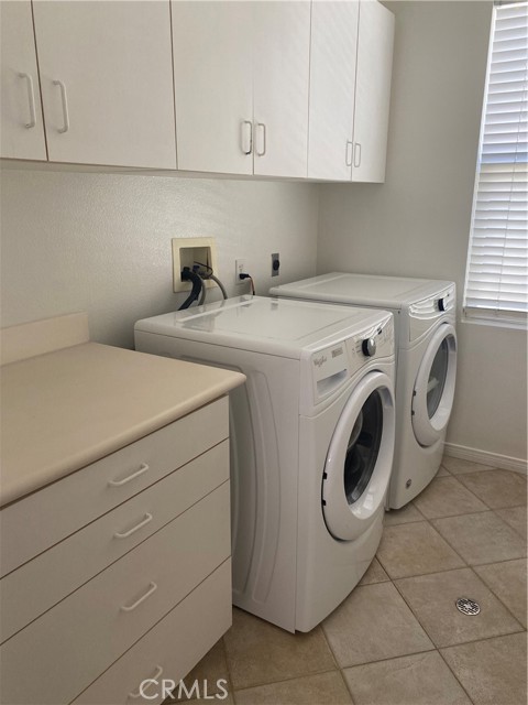 Upstairs laundry room with great folding counter