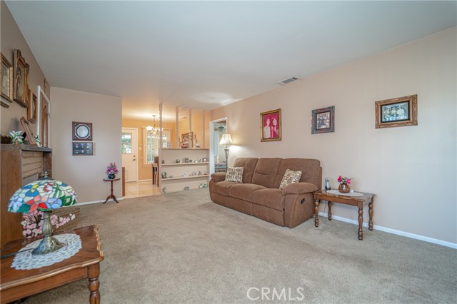 Picture of the living room standing at the corner of the living room.