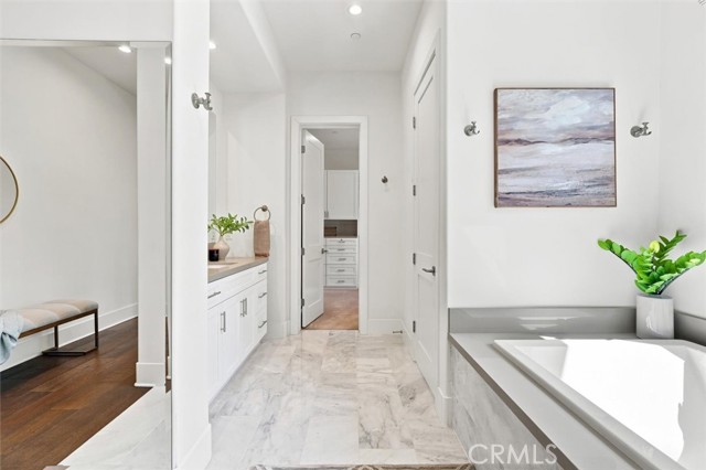 18 Phillips Ranch Road primary suite bath, walk in closet, and foyer. 18 Phillips Ranch Road primary suite bath, walk in closet, and foyer.
