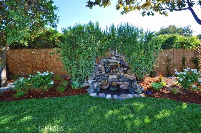 Grassy backyard with water fall