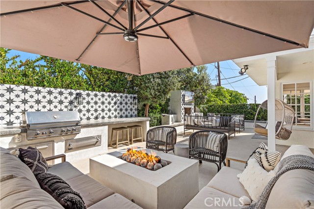 Large sectional seating and fire pit designed to accommodate dinner plates for outside dinning.