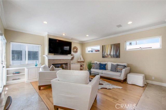 Family room third level.  Open floor plan to kitchen area.