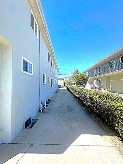 The long Driveway Leads From the Front of the Propeerty to the Rear Garages. The long Driveway Leads From the Front of the Propeerty to the Rear Garages.