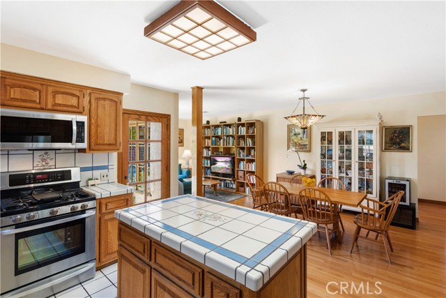 Kitchen with open concept to dining and den areas.