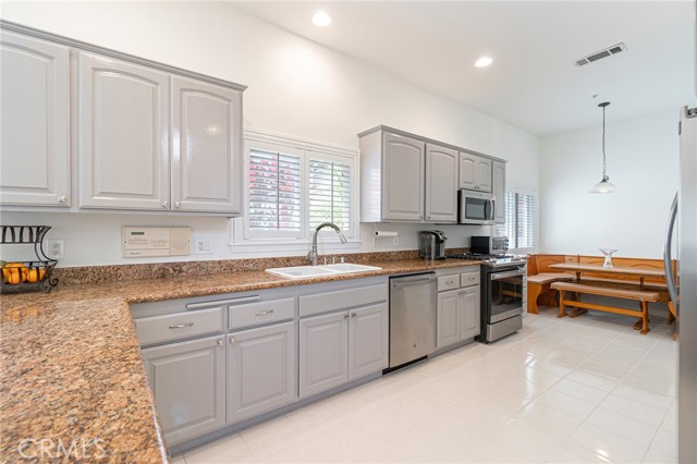 Kitchen with Stainless Steel Appliances, Granite counters, recessed lighting and tile flooring