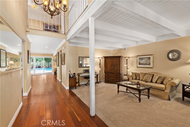 Formal living room with fireplace, new carpeting, and new paint.