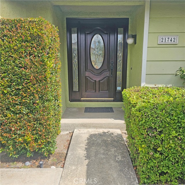 Beautiful front entry with stained glass windows.
