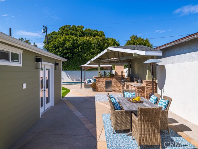 Looking down the patio area towards the pool & spa