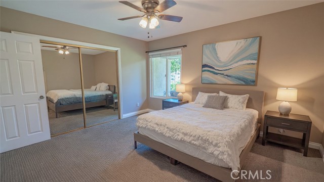 Primary Bedroom with Wall of Mirrored Closet