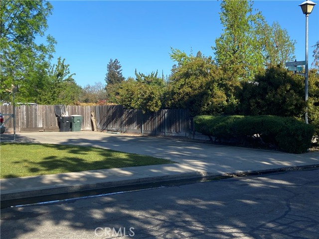 Large parking area in front of fence and more behind fence.