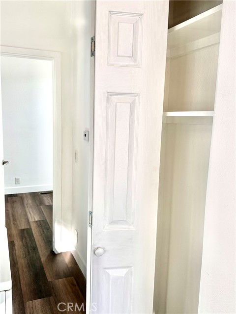 Hallway to Bedroom. Showing Pantry Storage