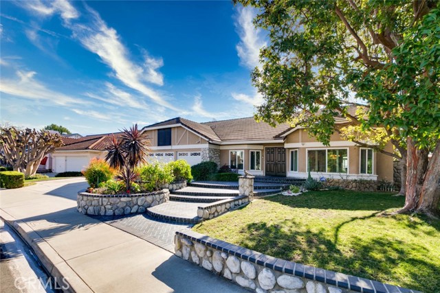 Welcome to this exquisite 2,868 sq ft single-family residence in the serene city of Yorba Linda. This meticulously maintained home features 3 spacious bedrooms, 3 bathrooms, and an office that can be converted into a bedroom, offering ample space for comfortable living.

Upon entering, you'll be greeted by upgraded carpeting that extends through the living room and all bedrooms, providing a plush and inviting atmosphere. The elegance of wood shutters throughout the house adds a touch of sophistication and privacy.

Significant updates include new windows and a garage door installed in 2020, enhancing both energy efficiency and curb appeal. In 2022, the AC, HVAC system, and water heater were replaced, ensuring modern comfort and reliability.

The beautifully landscaped backyard is designed for easy maintenance, allowing you to enjoy outdoor living without the hassle. From this vantage point, take in the amazing views overlooking Travis Ranch School and the city beyond, offering a picturesque and tranquil setting.

Education is a highlight in this community, with the property zoned for the highly rated Yorba Linda High School, recognized for its academic excellence. 

This home combines modern upgrades with a serene location, making it a perfect choice for those seeking comfort and convenience in Yorba Linda. Don't miss the opportunity to make this exceptional property your own.