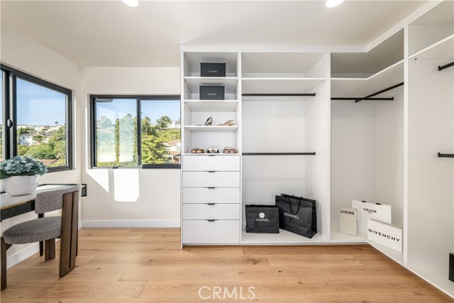 Primary bedroom walk-in closet