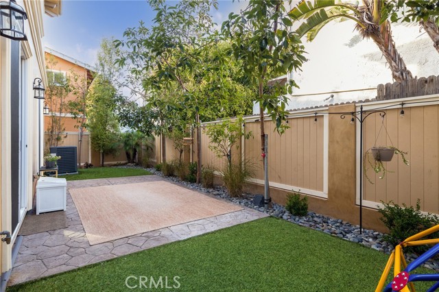 backyard features turf and privacy