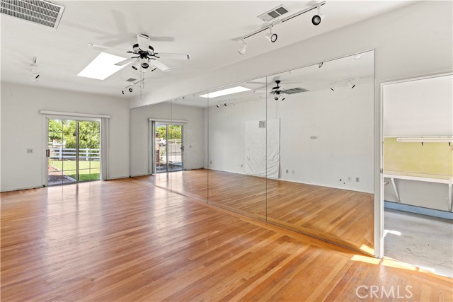 Dance Studio With One Mirrored Wall Looking Toward Workshop