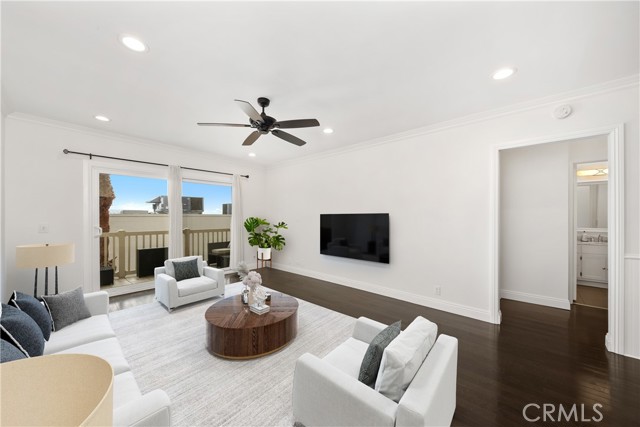 Virtually staged living room taken from kitchen